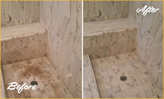 Before and After Picture of a Dirty Queen Creek Marble Shower Cleaned to Eliminate Dark Stains